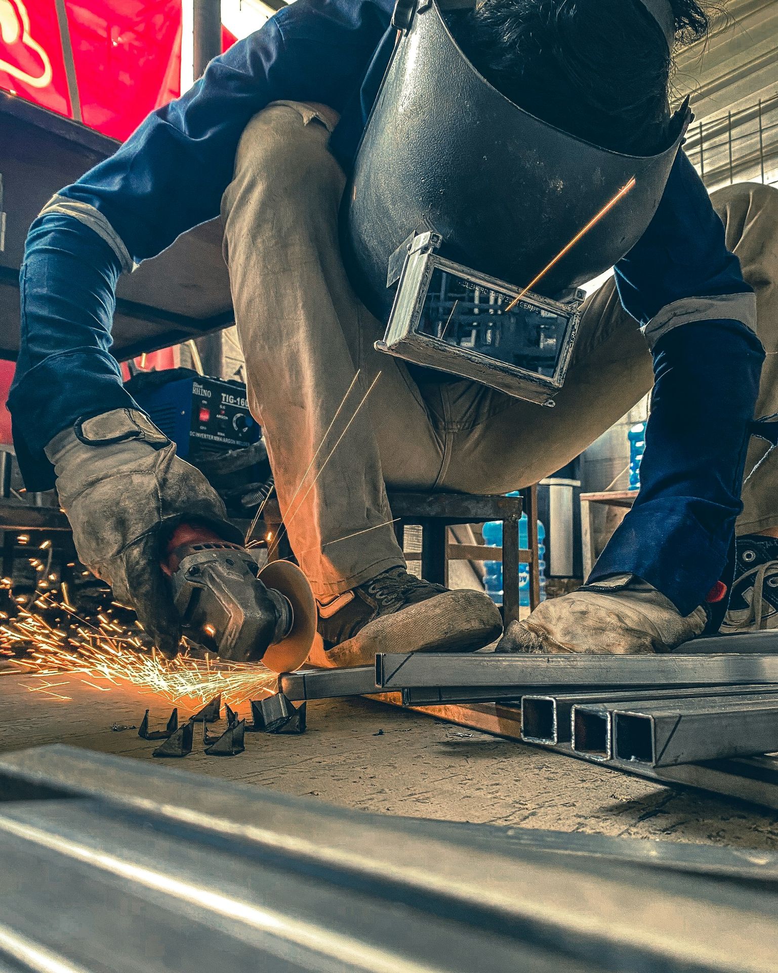 a man working on a piece of metal